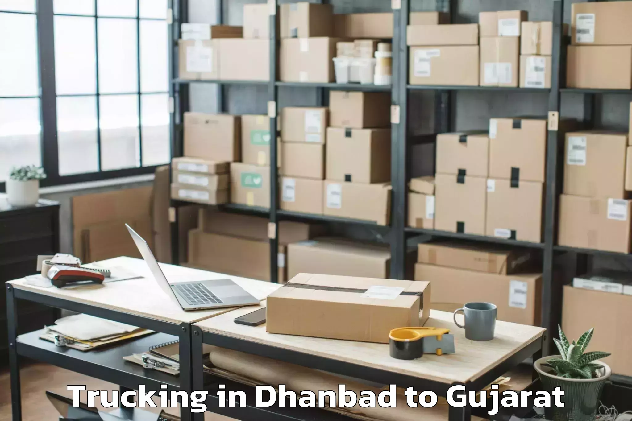 Dhanbad to Vejalpur Trucking Booking